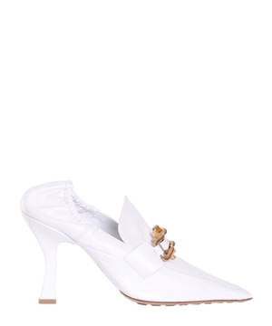 White pumps with metal details