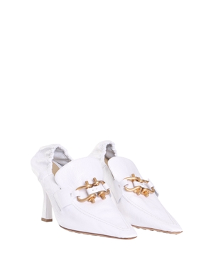 White pumps with metal details