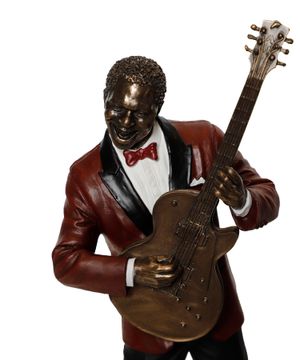 Guitar player statue