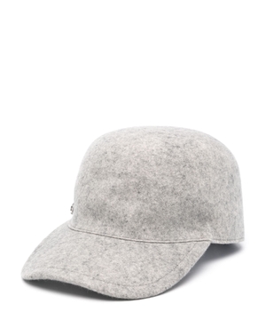 Cap with a metal pin