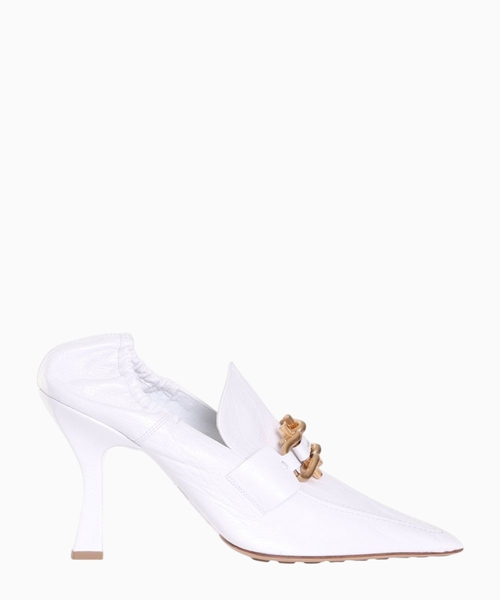 White pumps with metal details