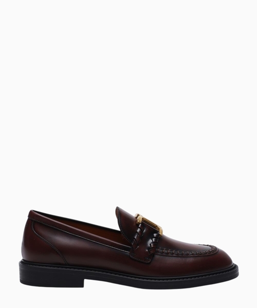 Metal logo applique detail leather loafers