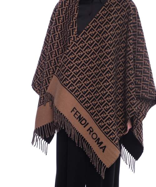 Poncho with fringe details and logo Emporium